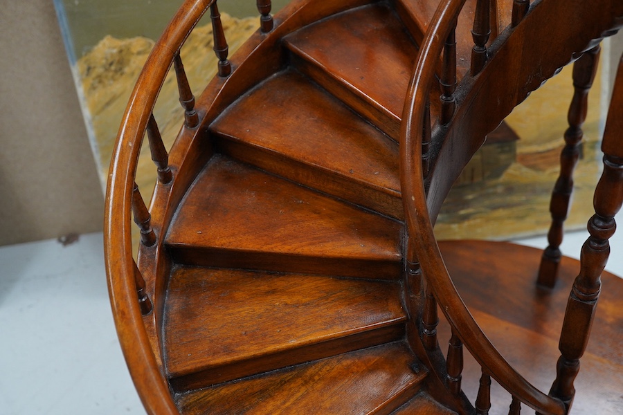 Theodore Alexander, Vietnam, a hardwood model of a spiral staircase, 61cm high, 46cm diameter, maker’s label to base. Condition - good.